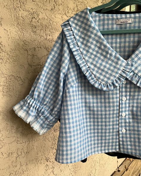 👚 Collared cuties 😍😍 Peter Pan collars, gingham, cottagecore aesthetic and alllll those ruffles are still THE moment right now— why not dive in? I loved creating these custom blue gingham and black gauze blouses for a client, based on the original floral version that I have in my inventory! 🌸 Swipe ➡️ to the end to see all of the fabrics I have available to make this top out of! Sizes XS-3X are all possible (depending on specific fabric choice). For my locals, don’t forget that I’ll be at... Peterpan Collar Blouses, Gingham Cottagecore, Peterpan Collar, Pan Collar Blouse, Peter Pan Collar Top, Peter Pan Collar Blouse, Peter Pan Collars, Upcycled Clothing, Cottagecore Aesthetic