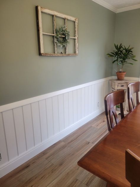 Green Panneling Rooms, Painted Half Wood Paneling Walls, White Panelling Green Walls, Wallpaper And Chair Rail Dining Room, 2 Tone Wall Paint Ideas Dining Room, Wainscotting In Kitchen, Kitchen Paneling Wall, White Half Wall Paneling, Boho Wainscoting Ideas