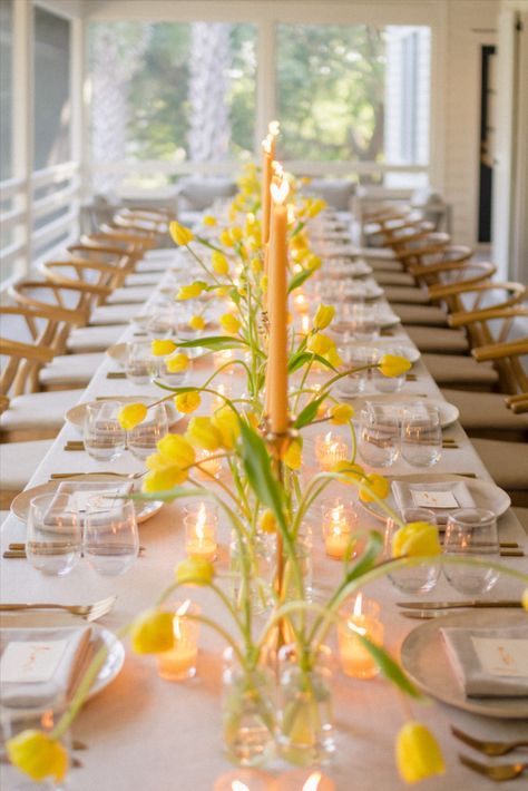 This beautiful porch dinner party is the epitome of spring! Bright tulips and votive candles paired with neutral china placed on top of a simple linen created the perfect spring dinner party decor. Tulip Theme Party, Porch Dinner Party, Tulip Wedding Theme, Spring Event Ideas, Spring Engagement Party, Spring Fling Party, Dinner Party Centerpieces, Tulip Centerpiece, Easter Porch Decor