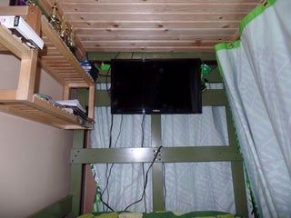 Bunk Bed Tv Ideas, Top Bunk Privacy Ideas, Bunk Bed Hacks Diy Storage, Tv Under Bunk Bed, Bunk Bed Fort Ideas, Top Bunk Shelf Ideas, Boys Bunk Bedroom Ideas, Lower Bunk Bed Decor Ideas, Dorm Top Bunk Ideas