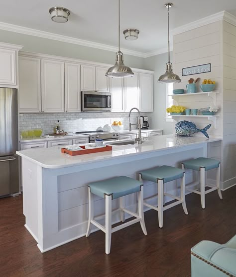 Open shelves gave the designer a place to add colorful accessories to the mostly white kitchen. Tv Unite, Awesome Kitchens, Beach Style Kitchen, Coastal Kitchen Design, Beach Kitchens, Condo Kitchen, Beach House Kitchens, Beautiful Kitchen Designs, House Beach