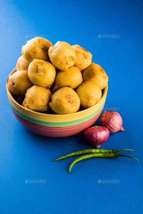 Batata Vada or Aloo Bonda by stockimagefactory. Batata Vada or Aloo Bonda is an Indian tea-time snack served with green chillies and tomato ketchup #Sponsored #stockimagefactory, #Indian, #tea, #Bonda Batata Vada, Indian Tea, Tea Time Snacks, Tomato Ketchup, Ketchup, Chutney, Tea Time, Serving Bowls, Snacks