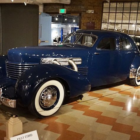 In 1937, the Cord 812 was introduced with an optional long 132-inch wheelbase chassis called the Custom. With an extra 7 inches in length and 1.5 inches in interior headroom, the rear sear became much more accessible. Gordon Buehrig stated the larger Cord "was a result of criticism that the car in the price class it was in didn't have enough room in it for some people's taste." You will notice there are eight hood louvers, instead of seven. This is a visual cue of the Custom's added dimensions. The sheet metal panels for the Custom were not only fabricated, but also modified from a standard Sedan body. This required more body solder, or lead, which meant greater hand finishing. But the low cost of skilled labor ruled out the expense of creating large dies to press large single panels. Tech Cord Automobile, Cord Car, Antique Cars For Sale, Visual Cue, Fast Sports Cars, Vintage Muscle Cars, Classic Cars Trucks Hot Rods, Old Classic Cars, Classy Cars