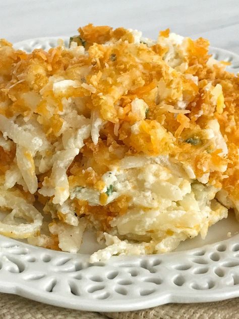 Frozen shredded potatoes make this cheesy shredded potato casserole side dish so easy to prepare! Loaded with cheese, green onions, and sour cream. Topped with a crunchy & cheesy topping that gets crispy while cooking Frozen Shredded Potatoes, Shredded Potato Casserole, Shredded Hashbrown Recipes, Casserole Potatoes, Cheesy Potatoes Recipe, Casserole Side Dishes, Cheesy Potato Casserole, Frozen Potatoes, Baked Potato Casserole