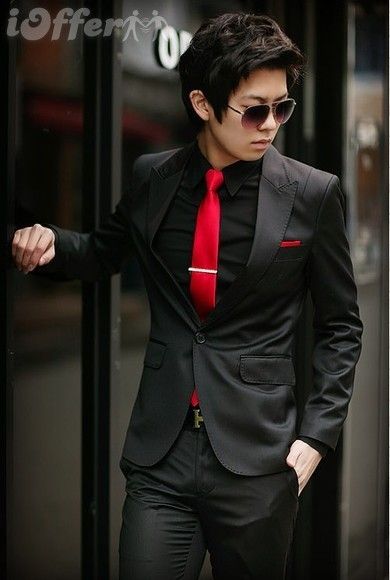 Tybalt would stand out in this classy yet catty suit. It puts a spin on the classic black tux by adding a splash of red for his sneaky intentions. All Black With Red Tie, Black Tuxedo With Red Tie, Black Tux Red Vest, Black Suit Red Tie Aesthetic, Red And Black Wedding Suits Men, Red And Black Prom Suits For Guys, Black Suit Red Tie Prom, Black Tux Red Bow Tie, Black Suit Dark Red Tie