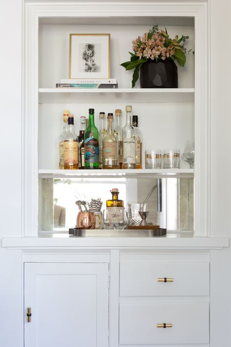 Read More: https://www.stylemepretty.com/living/2016/09/21/crafting-a-dream-bungalow-in-venice-beach/ Built In Bar Cabinet, Dream Bungalow, Bookshelf Bar, Station Photography, Bar Nook, Built In Buffet, Bar Station, Built In Bar, Home Bar Designs