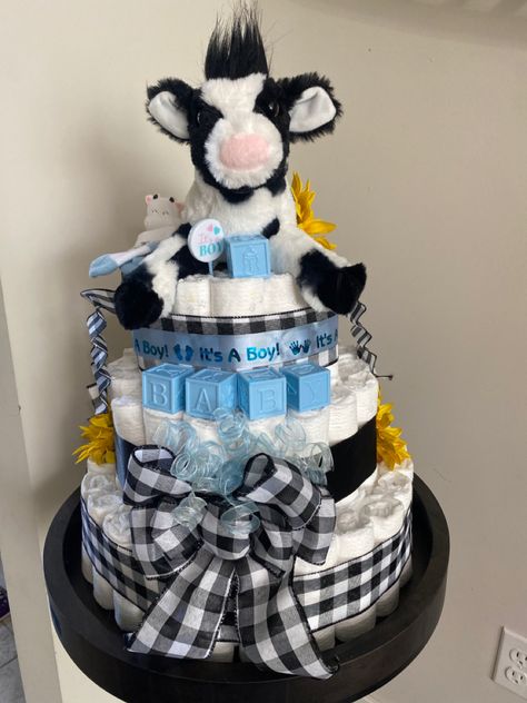 Cow Diaper Cake Baby Boy, Farm Themed Baby Shower Ideas Boys, Baby Boy Farm Shower Ideas, Cow Boy Baby Shower Ideas, Baby Shower Ideas Cow Theme, Farm Baby Shower Theme Boys, Cow Baby Shower Centerpieces, Cow Baby Shower Theme Boys, Baby Farm Animals Shower Ideas