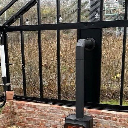 Jøtul Stoves on Instagram: "A little recap of @burlinmarianne ‘s gorgeous greenhouse🌱 Have you moved into your greenhouse yet?  #jotul #jøtul #greenhouse #greenhouselife #woodburningstove #fireplace #gardeninspiration #gardenlove #greenhouses" Green House With Wood Stove, Fireplace In Greenhouse, Stove In Greenhouse, Greenhouse Fireplace, Greenhouse With Fireplace, Greenhouse Heating Ideas, Greenhouse Heaters, Greenhouse Farming, Stove Heater