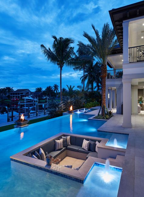 This infinity pool is seated on the edge of a bay and features a sunken lounge area. Designed by MHK Architecture in Naples, Florida. Mcdonald Interior, Sunken Lounge, Resort Plan, Dream Backyard Pool, Dreams Resorts, Outside Pool, Pool Finishes, Villa Pool, Backyard Adventure