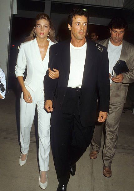 Actor Sylvester Stallone and date Jennifer Flavin attend Mike O'Hara's Power Polo and Cocktail Reception to Benefit Vital Options on August 26 1988... Angeles, Sylvester Stallone 80s, Steve Mcqueen Style, Jennifer Flavin, 90s Actors, 80s Photos, Carpet Outfits, Equestrian Center, Silky Shirt