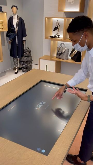 Rettech | Retail Tech Experiences on Instagram: "Inside ABC @dior , SoHo (NYC) where clients can: - Browse a collection of bags through a table touch screen - Personalize their bag’s pattern - Add initials and emojis - See how the bag looks like in 3D - Scan a QR code to save their custom bag for later - Receive the link in their email and share it with friends. Get inspired!💎 #tech #retail #retailtech #digitalexperience #abcdior #abcdiorpopup #diornyc #luxurytech #digitalluxury #newretail # Touch Screen Table, Fragrance Display, Digital Retail, Retail Experience, Soho Nyc, Store Ideas, Clothing Retail, Touch Screen Display, Luxury Store