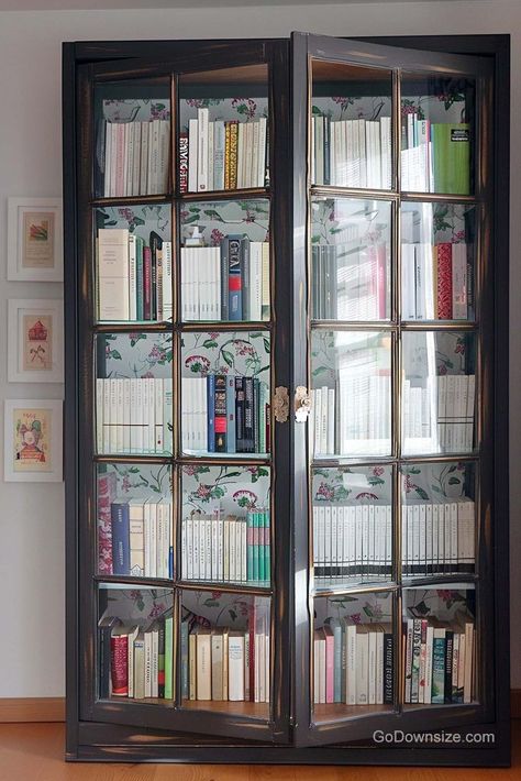 Scaling things up is this tall, wooden antique bookcase with a print that has an enchanting pattern on it to line the insides. Bookcase With Door, Glass Cabinet Bookcase, Book Rack Design With Glass Door, Library With Glass Doors, Library Glass Doors, Book Shelves With Glass Doors, Bookshelves Glass Doors, Bookshelves With Glass Doors, Bookshelves Ideas For Bedroom