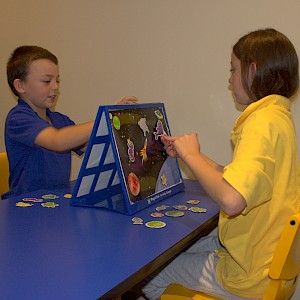 Barrier games are played like the board game Battleship. Two people sit opposite each other with a barrier (e.g. box, or book) in the space between them. Instructions are spoken (or written depending on the goal) for each person to follow. The aim of this idea is that when the barrier is removed both the child and adult will have the same result (e.g. same picture scene or Lego construction). This will be because the child has listened carefully and/or gave clear accurate instructions. Physical Barriers To Communication, Barrier Games, Lotto Games, Make Your Own Game, Support Worker, Games For Fun, Same Picture, Lego Construction, People Sitting