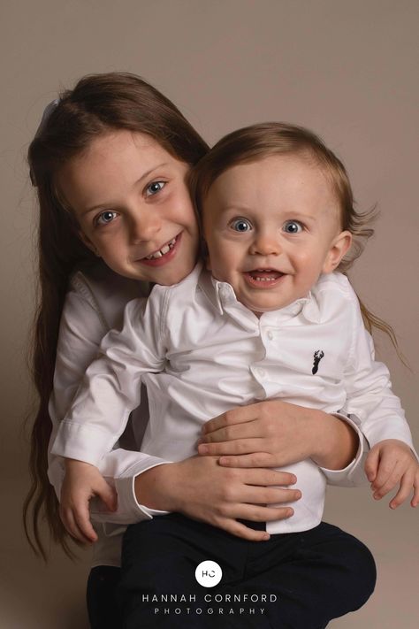 Girl and younger brother (older child and toddler) both in white shirts and dark trousers posing for family photograph. Studio Sibling Photoshoot, Siblings Studio Photoshoot, Studio Sessions Photography, Medway Kent, Sibling Photoshoot, Kent Family, Sibling Photography Poses, Sibling Photo Shoots, Poses Photoshoot