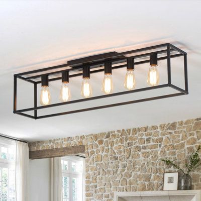 6 lights cage style kitchen island ceiling light, it has a rectangular steel frame that comes in a matte black or black with gold finish for a modern farmhouse look we love. It is a special design for low purposely designed for low-rise ceiling houses, which is popular for your kitchen island, dining room table, rectangular coffee table, bedroom, foyer, entryway, etc. As a perfect mix of function and aesthetics with a unique look, the kitchen chandelier is sure to impress! | 17 Stories 6 Lights Dining Room Light Low Ceiling, Chandelier Dining Room Farmhouse, Dining Room Table Light Fixture, Dining Room Table Light, Kitchen Island Ceiling, Style Kitchen Island, Island Ceiling Light, Coffee Table Bedroom, Frame Sign