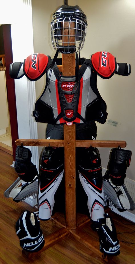 Hockey equipment stand. 60" tall. 30" wide. Dowels to support gloves and skates. Air your equipment out, and look good doing it. Hockey Tree Drying Racks, Hockey Drying Rack Diy, Hockey Gear Drying Rack, Hockey Equipment Drying Rack, Hockey Gear Storage, Hockey Drying Rack, Hockey Equipment Storage, Hockey Organization, Hockey Storage