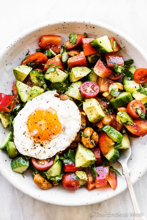 PIN TO SAVE! This is the breakfast salad we make over and over. It's full of cucumbers, cherry tomatoes, bell peppers, avocado, toasted nuts. It's fresh, crunchy, flavorful, and perfect with an egg on top. #theendlessmeal #breakfastsalad #breakfast #salad #brunch #brunchsalad #healthybreakfast #breakfastideas #glutenfree #vegetarian #lowcarb #keto #healthy #healthyrecipe The Endless Meal Recipes, Salad For Breakfast, Brunch Salad, Breakfast Vegetables, Breakfast Sides, Salad Easy, Healthy Eggs, Breakfast Salad, Diner Recept