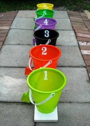 Reminds me of the Bozo Show's Grand Prize game. Each bucket denotes a certain prize - #1 equals a small simple prize. #6 equals a more substantial prize. Fall Festival Games, Fest Ideas, Fun Halloween Party Games, Fall Carnival, Fun Halloween Games, Festival Games, Halloween Games For Kids, Carnival Theme, Harvest Party