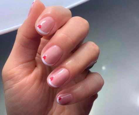 Valentine’s Day French Manicure Ideas that Will Give You All the Love Vibes French Manicure With Red Heart, Valentine Manicure Ideas, Valentines Manicure Ideas, French Valentine Nails, French Manicure With Heart, Manicure With Hearts, Nail Tips Designs, Valentines Day Manicure, Best French Manicure