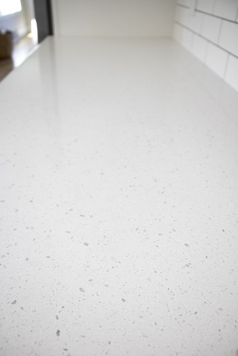 The most timeless quartz options are simple and neutral like in this picture! Terrazzo Look Countertops, White Speckled Quartz Countertop, Frost White Quartz Countertop, Terrazo Countertops Kitchen, Simple Granite Countertops, White Speckled Countertops, Speckled Quartz Countertops, Sparkling White Quartz Countertop, White Quartz Countertop Kitchen