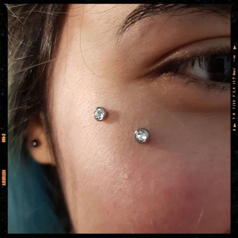 Surface Piercing | Surface piercing, Body jewelry piercing, Facial piercings Anti Eye Brow Piercing, Anti Eyebrow Piercing Dermal, Over Eyebrow Tattoo, Face Dermal Piercing Cheek, Piercing Under Eye, Anti Eyebrow Piercing Aesthetic, Cheek Bone Piercing, Surface Piercing Face, Cheekbone Piercing