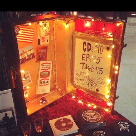 The merch display I created with a friend by revamping a vintage suitcase Suitcase Merch Display, Band Merch Booth Display Ideas, Band Merch Table Display, Band Merch Display Ideas, Band Merch Table, Merch Table Ideas, Band Merch Display, Diy Merchandise Display, Diy Band Merch Ideas