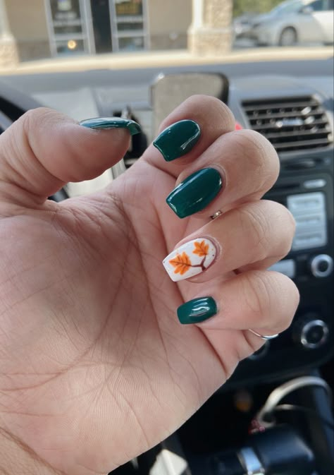 Coffin acrylic Dark teal nails with white and leaf design on ring finger Fall Leaves Nails Ideas, Cute Fall Short Nail Designs, Dark Teal Pedicure, Fall Leaf Nails 2022, Dark Teal Fall Nails, Teal Nails Fall, Nails For September 2023, Turquoise Fall Nails, Neon Fall Nails