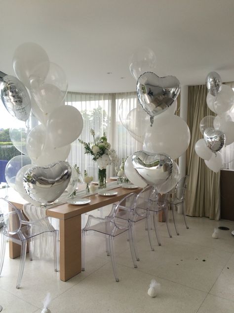 Inspired by Gatsby, these custom arrangements with a mix of 17" and 12" latex in white and Diamond Clear with silver Heart Foils were the perfect companion to the flowers in this intimate reception Engagement Balloons Decoration, Intimate Reception, Engagement Balloons, Balloon Gifts, Balloons Bouquet, Balloon Clusters, Balloons Decoration, Wedding Decorating, Balloons Decorations