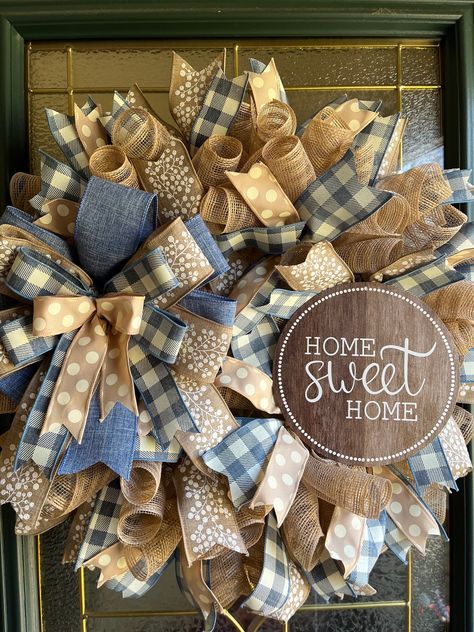 Beautiful Farmhouse rustic country style wreath that can be displayed on a front door, wall, interior door, or over a fireplace mantel. Beige deco mesh, denim blue and ivory checked wired ribbon, solid denim blue wired ribbon, beige with white berries wired ribbon, beige and ivory polka dot wired ribbon, matching ribbon bow, and a Home Sweet Home metal sign are securely attached to a wire frame made to last for years to come. Makes a great gift for a birthday, housewarming, or any occasion. All Big Wreath, Diy Deco Mesh Wreath, Fall Mesh Wreaths, Mesh Ribbon Wreaths, Farmhouse Style Wreath, Home Wreath, White Berries, All Season Wreath, Country Wreaths