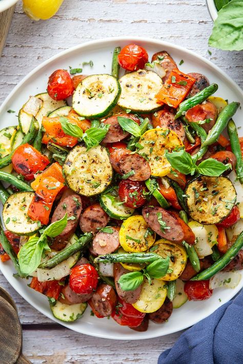 Marinated in a flavorful vinaigrette and grilled to smoky perfection, these grilled summer vegetables and sausage will satisfy both meat-lovers and veggie-lovers! Grilled Sausage And Veggies, Summer Sausage Salad, Grilled Italian Sausage Recipes, Grilled Summer Vegetables, Veggie Loaded Dinner, Summer Camping Meals, Sausage On The Grill, Meat And Veggie Meals, Grilled Sausage Recipes