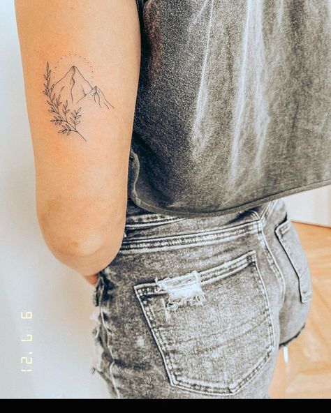 Elegant Western Tattoos, Mountain With Wildflowers Tattoo, Small Mountain Tattoos For Women Forearm, Mountain Name Tattoo, Sunshine Mountain Tattoo, Inner Arm Mountain Tattoo, Mountain With Stars Tattoo, Mountain Floral Tattoo, Floral Mountain Tattoo