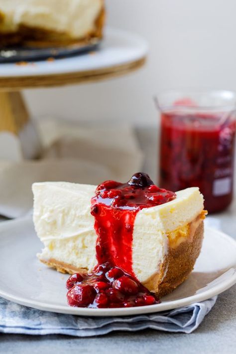 This easy classic baked cheesecake infused with lemon zest is super creamy and the buttery crust is perfect. Served with an easy berry sauce, it is the ultimate indulgent dessert. #baking #recipeoftheday #dessert #cheesecake #cakea Berries Sauce, Dessert Counter, Baking Thanksgiving, Pastry Photography, Original Cheesecake, Thanksgiving Cheesecake, Lemon Curd Cheesecake, Dessert Cheesecake, Dairy Free Cheesecake