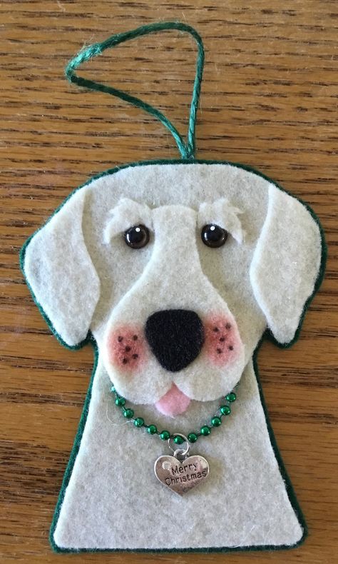 The image is felt on the front and back. Has plastic doll eyes and wears a metal, heart shaped charm that says Merry Christmas. Very light weight. Spot clean and store flat please. The ornament measures approximately 4" wide and 4 7/8" tall not including the hanger. Thoughtful gift anytime of the year. Felt Dog Ornament Pattern Free, Dog Felt Pattern, Felt Dog Pattern, Felt Angel Ornaments, Dog Ornaments Diy, Iris Cards, Felt Creatures, Ornament Inspiration, Apple Valley California