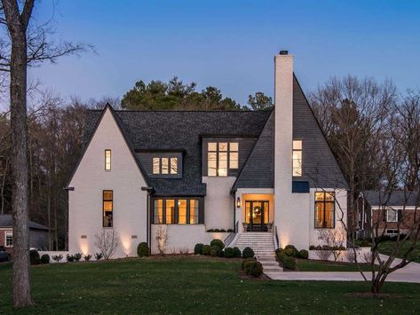 Inside a contemporary home tour in Nashville that left us speechless Tudor Renovation, Dark Academia Library, Academia Library, Nashville Real Estate, Modern Tudor, Rear Elevation, Backyard Views, Ball Wreath, Room Screen