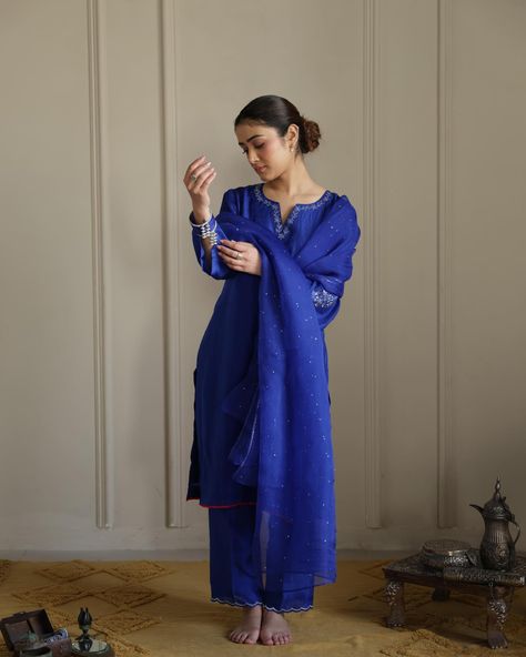 SITARA , in Cobalt Blue! This statement monotone ensemble is the star of the collection, LITERALLY ! 😍 Created it super lightweight pure silk, the surface is adorned by beautiful and delicate tone on tone floral embroidery details. The look is completed by hand-done mukaish organza dupatta. SHOP NOW AT finerthingsbyseerat.com #puresilk#luxuryfabrics#newcollection#indianwear#ethnicfashion#heritage#timelesstradition#ibtidaa#finerthingsbyseerat#embroiderydetails Salwar Design, Cobalt Dress, Acrylic Rangoli, Combination Dresses, Salwar Designs, Traditional Indian Outfits, Womens Dress Suits, Suits Design, Embroidery Suits Design