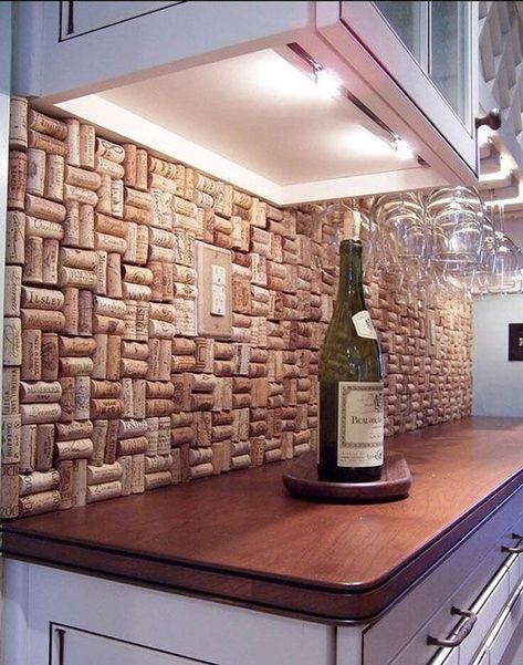 Wine lovers can enhance their kitchens with creative backsplashes that showcase decorative corks. These corks are easy to stick on the walls and are budget-friendly, offering a stylish look in modern settings. The sky's the limit when it comes to unique kitchen backsplash ideas. Wine Corks Ideas, Cork Decorations, Wine Cork Decor, Wine Corks Decor, Creative Kitchen Backsplash, Cork Decor, Wine Cork Diy Projects, Cork Diy Projects, Backsplash Diy