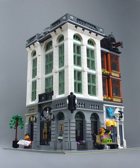 https://flic.kr/p/KX6Adu | Brick Bank Modification | Modified version of the LEGO Brick Bank (#10251).  There's now an ATM and the additional floor provides room for an insurance agent, who might not be the most respectable one. Lego Bank Ideas, Lego Apartment Building, Minecraft Bank Ideas, Minecraft Bank Building, Bank Minecraft, Bank Lego, Minecraft City Buildings, San Myshuno, Lego Buildings