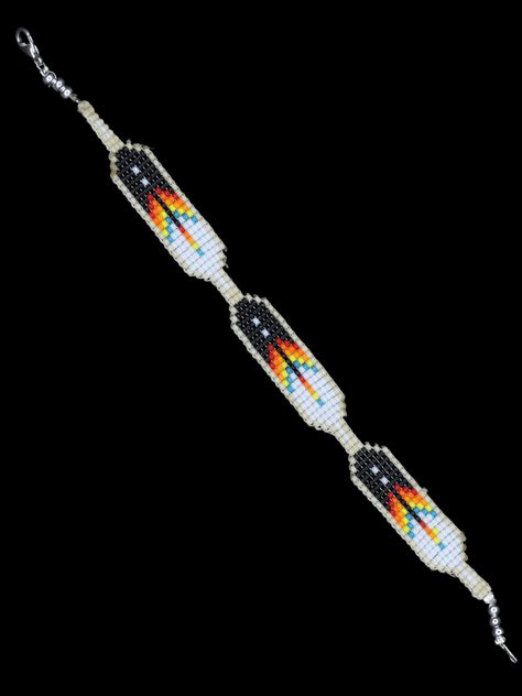 These intricate bracelets featuring feathers are hand-made on a special loom. Beadwork is a very special skill that has been passed down from generation to generation among our people (the Diné or Navajo). Each piece is so beautifully unique with all hand-strung beads. Shirley Originals **Resizing Not Available Shirley has been making jewelry since she was a very young child. This puts Shirley's skill level into the expert realm.Growing up in the heart of the Navajo Nation, Shirley learned this skill from her mother.Shirley is of the Many Goats clan and is born for the Tangle Clan.Shirley says her favorite part of making jewelry is the ability to support her family. Her mother began making jewelry as a means to provide for Shirley and her siblings when they were young. She was a single mot Native American Bead Patterns, Native Bead Bracelet, Beaded Native Bracelets, Native Beaded Bracelets Loom Patterns, Bead Loom Bracelet Patterns Free Native American, Native American Beadwork Patterns Free, Native American Beading Patterns Free, Native Beadwork Patterns, Bead Feather Pattern