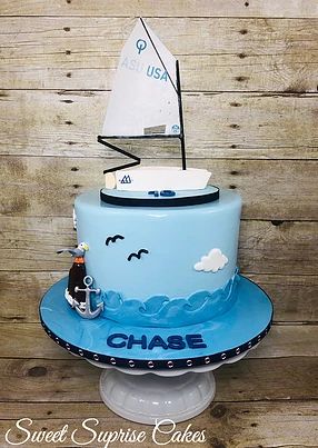 Boat Cake Sail boat McLaughlin sailboat Topper Sea cake #sweetsuprisecakes #sailboat #sailingcake Sail Cloth Benjamin Moore, Optimist Sailboat, Sailing Boat Cake, High School Graduation Cupcakes, Sailing Cake, Graduation Cupcake Cake, Graduation Cupcake Stand, Sailboat Cake, Kindergarden Graduation