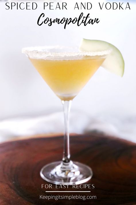 A gently spiced pear and vodka cosmopolitan that is perfect for the Fall and Winter and so easy to make. Spiced Pear Liqueur Cocktails, Pear Alcoholic Drinks, Fall Pear Cocktail, Spiced Pear Martini, Pear Cocktails Fall, Pear Drinks Alcohol, Thanksgiving Cosmopolitan, Pear Cosmopolitan, Pear Vodka Cocktails