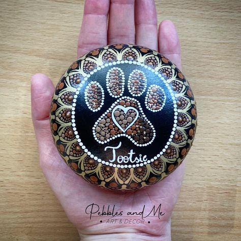 Handmade stone hand painted and customised for Tootsie, the dog. Pet memorial stones are becoming very popular at Pebbles and Me. Please contact me directly if you would like to order one. Paw Mandala, Cat Memorial Ideas, Bournemouth England, Dog Memorial Stone, Dog Lovers Art, Mandala Painted Rocks, Diy Rock Art, Rock Sculpture, Pet Memorial Stones