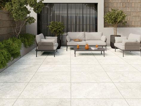 This white matte Pietra Blanco Porcelain Paver Tile is 24 x 36.This tile has inkjet print quality, which produces a high definition image that thoroughly covers the tile and results in a natural, authentic look. Pressed tiles require more prominent grout lines, and the rounded edges allow for a smoother transition. Bring the charm of the outdoors inside with slate-look tiles. Available in an amazing range of patterns, styles, and textures, slate-look porcelain tiles are perfect for both indoor a Porcelain Pavers Patio, Outdoor Tiles Over Concrete, Outdoor Tile Over Concrete, Porch Tiles Outdoor, Patio Tiles Outdoor Flooring, Large White Concrete Pavers, Porcelain Pool Pavers, Patio Tile Ideas, Satori Porcelain Pavers