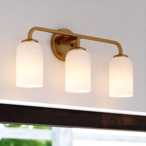 Shelby Gold Brass Transitional Bathroom Vanity Light Fixture White Glass - Bed Bath & Beyond - 40749484 Half Bath Lights, Brass Lighting Bathroom, Vanity Lighting Over Mirror, Brass Bathroom Fixtures, Brass Bathroom Lighting, Transitional Bathroom Vanity, Vanity Light Shade, Stucco House, Gold Lights