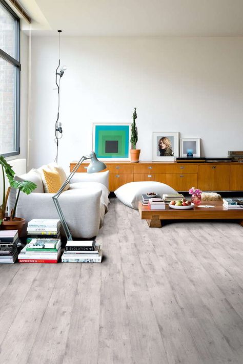 Lighten up any room in your home or office with the Quickstep Impressive Concrete Wood Light Grey laminate flooring from Flooringsupplies.co.uk. The textured surface and fresh tone will lift a room’s atmosphere making it seem more spacious, plus the incredible technology from Quickstep means that it feels just like real wood underfoot, you won’t believe that it’s a laminate! Grey Laminate Flooring, Ruangan Studio, Inexpensive Flooring, Waterproof Laminate Flooring, Tidy House, Grey Floor, Grey Laminate, Quickstep, Flooring Inspiration