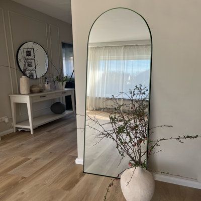 Brighten up any room in your home with this tall, elegant modern full length mirror. Its unique arched design and sleek frame make it a statement piece that adds depth and dimension to any room. From a distance, it looks like a door or a window, making it more artistic and highlighting the beauty of the body mirror. Its exceptional quality is highlighted by an affordable price point, offering you a remarkable value for your investment. Order now to transform your home with this remarkable mirror Floor Mirror Entryway, Tall Standing Mirror, Modern Full Length Mirror, Tall Bed Frame, Full Length Mirror Stand, Stand Mirror, Arched Design, Long Mirror, Floor Standing Mirror