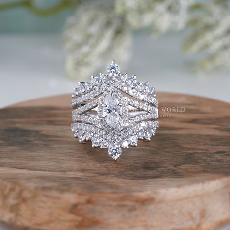 💍 𝐈𝐭𝐞𝐦 𝐃𝐞𝐬𝐜𝐫𝐢𝐩𝐭𝐢𝐨𝐧 💍 Art Deco Bridal Engagement Ring With Enhancer, Enhancer Wedding Ring Sets For Women, Moissanite Ring Guard Set Marquise Halo Ring Jacket Set, Unique Design and Style By Gelson World.  💍 𝐌𝐄𝐓𝐀𝐋 💍 ✶Solid 10K/14K Yellow/White/Rose Gold ✶ Solid 925 Sterling Silver ✶ Rhodium Plated 💍 𝐌𝐀𝐈𝐍 𝐒𝐓𝐎𝐍𝐄 💍 ✶ Stone Shape : Marquise Cut ✶ Stone Type : Moissanite  ✶ Stone Size : 8x4 MM ✶ Carat Weight : 0.50 Ct ✶ Moissanite Color : Near Colorless ✶ Moissanite Clarity : VVS1   💍 𝐒𝐈𝐃𝐄 𝐒𝐓𝐎𝐍𝐄𝐒 💍 ✶ Stone Shape : Round Cut  ✶ Stone Type : Moissanite ✶ Moissanite Color : Near Colorless ✶ Moissanite Clarity : VVS1 💍 𝐓𝐎𝐓𝐀𝐋 𝐂𝐀𝐑𝐀𝐓 𝐖𝐄𝐈𝐆𝐇𝐓 💍 ✶ Total Carat Weight : 2.35 Tcw 💍 𝐏𝐑𝐎𝐃𝐔𝐂𝐓 𝐈𝐍𝐂𝐋𝐔𝐃𝐄𝐒 💍 ✶ Engagement Ring ✶ Jewelry Ring Guards Enhancer For Marquise, Ring With Enhancer, Wedding Band For Marquise Ring, Marquise Wedding Band Set, Wedding Ring Guard, Western Wedding Rings, Pear Shaped Diamond Engagement Rings, Wedding Ring Sets Unique, Vintage Inspired Engagement Rings