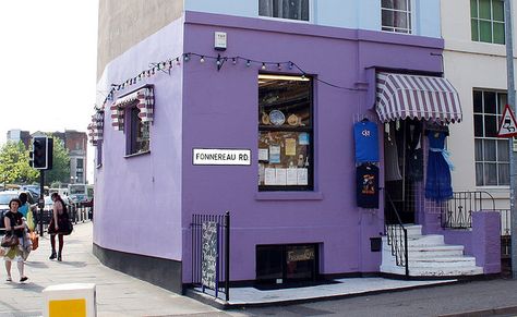 Purple Corner Shop. Purple Store Design, Purple Building, Purple Cafe, Shop Facade, Bookstore Cafe, Building Front, Yellow Interior, Shop Fronts, Shop Front