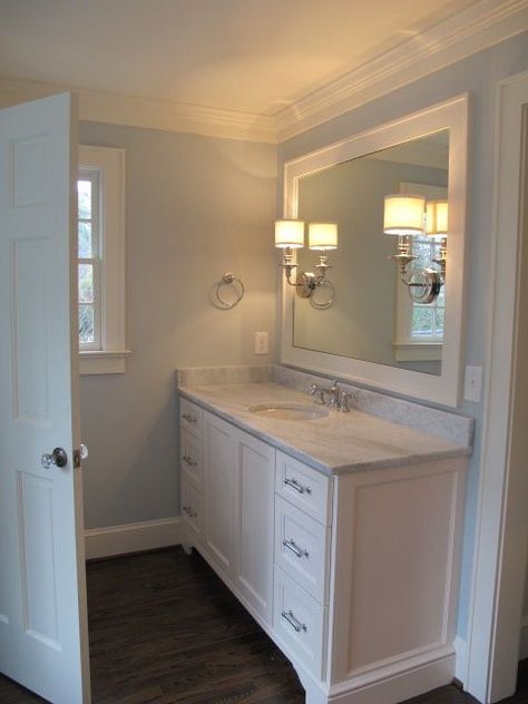 dark wood floor, white vanity Treehouse Bathroom, White Bathroom Mirror, Dark Wood Bathroom, Blue Painted Walls, White Bathroom Cabinets, Wood Bathroom Vanity, Dark Wood Floors, Gorgeous Bathroom, White Vanity Bathroom