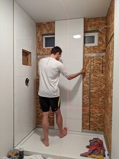 Step 2 DIY laminate shower wall panel installation | Innovate Building Solutions | #LaminateWallPanels #ShowerWallPanel #BathroomRemodel Laminate Wall Panels, Cleaning Shower Tiles, Diy Tile Shower, Makeover Kamar Mandi, Shower Remodel Diy, Bathroom Shower Panels, Tub To Shower Conversion, Shower Conversion, Shower Renovation