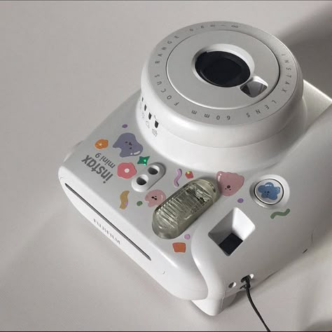 Instax polaroid with aesthetic cute stickers. Instagram aesthetic white filler picture. White Instax Camera Aesthetic, Polaroid Camera With Stickers, Decorating Polaroid Camera, Polaroid Camera Decoration, Instax Liplay Aesthetic, Camera With Stickers Aesthetic, Instax Printer Aesthetic, Aesthetic Instax Camera, Instax Mini 9 Aesthetic